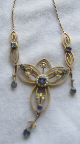 A 9ct gold necklace set sapphire and seed pearls. - Image 2 of 2