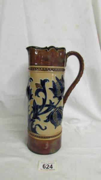 A 10.5" tall jug by Royal Doulton. Cream ground for main body and brown for the top and bottom.