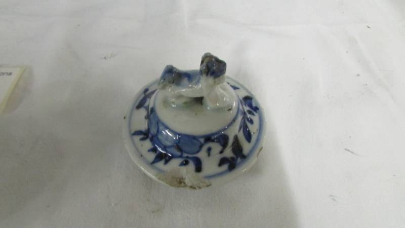 A pair of early Chinese blue and white lidded vases (both lids a/f) and a blue and white flask. - Image 6 of 25