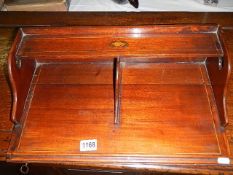 An inlaid desk top letter rack.