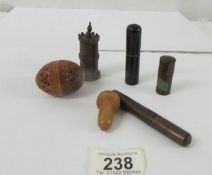 Five pieces of treen comprising four needle holders (one in the shape of an castle), one pen nib and