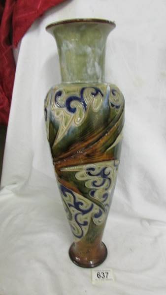 A Doulton 17" high vase with a floral design. 301 M.V.M. and another mark.