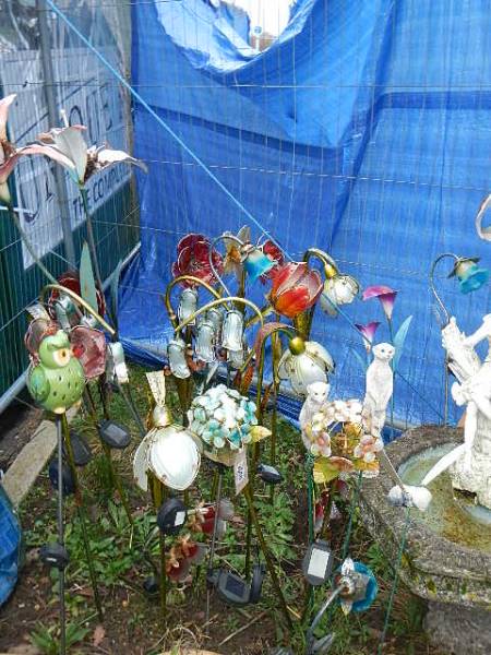 A large lot of mainly metal floral and animal garden ornament on tall metal spikes. Collect only.