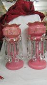 A pair of Victorian pink glass lustre's, 39 cm tall. Collect only.