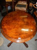 A superb quality oval mahogany inlaid tip top loo table.