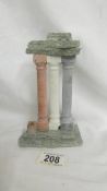 A Grand Tour style model of classical columns with marble base.