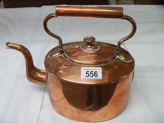 A Victorian oval polished copper kettle.