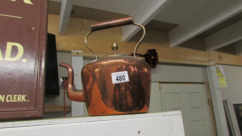 A Victorian polished copper kettle.