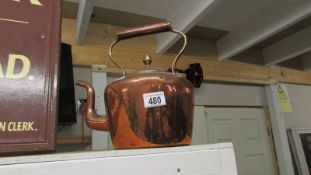 A Victorian polished copper kettle.