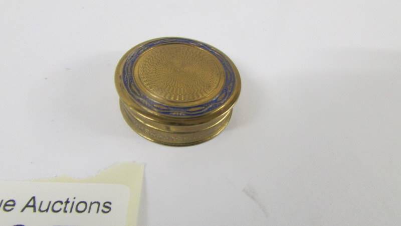 A silver circa 1977 pill box and a miniature engine turned powder compact. - Image 3 of 4