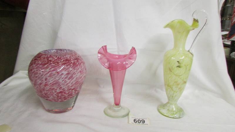 A pink glass vase, a yellow jug and a cranberry glass vase (chipped).