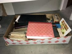 A box of ephemera, postcards & books etc.