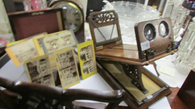 A good Victorian stereoscopic viewer marked with Crown Treasury, complete with box of cards. in
