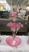 A cranberry glass epergne, in good condition.
