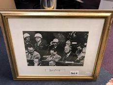 A framed photo print of the Nuremberg Trials with signatures of Lord Shawcross Chief British