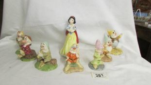 A Royal Doulton Snow white and the seven dwarfs figurines.