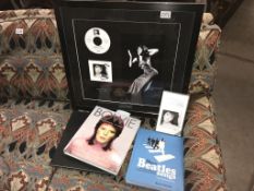 A limited edition print/signed CD of Kate Bush with unique Black and white photo by J.Bangay in