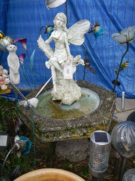 A fairy statue on a bird bath (one wing missing) 87 cm tall. Collect only.
