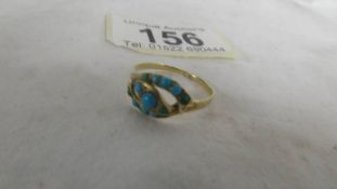 A turquoise set ring, size R. (tests as gold)