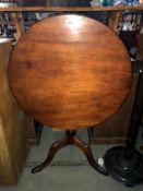 A Victorian mahogany tip up tea table on tripod base - 75cm diameter x 73cm high