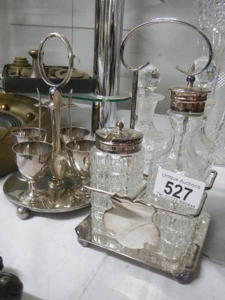 A silver plate four bottle cruet and a silver plate egg cup stand. - Image 2 of 2
