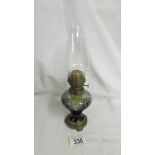 A 19th century Doulton Lambeth stoneware oil lamp, Total height 26.5cm including chimney.