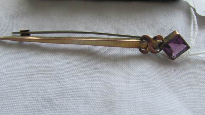 Three antique stick pins and a brooch including gold examples. - Image 2 of 3