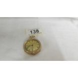 A 14ct gold fob watch with chased gold work. Wound to limit, diameter 34mm, weight 34.8g