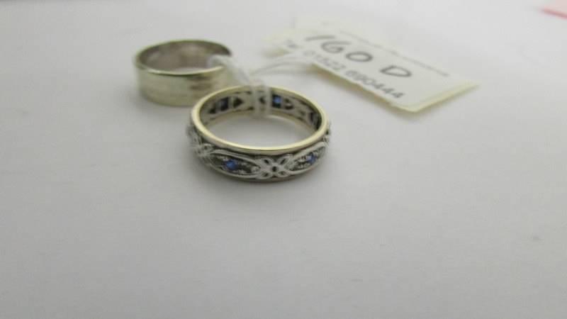 A 9ct gold wedding ring and an unmarked eternity ring, size N. - Image 2 of 3