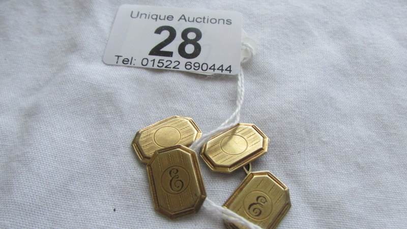 A pair of 9ct gold cuff links, monogrammed 'E'. 4.4 grams.