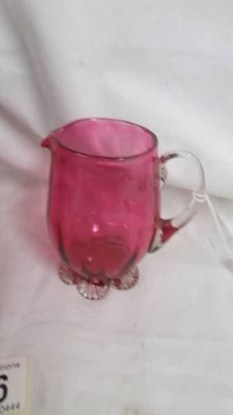 A cranberry glass cream jug and sugar bowl. - Image 2 of 3