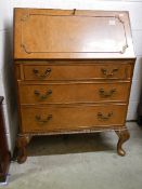 A good burr walnut bureau with fitted interior, in good condition.