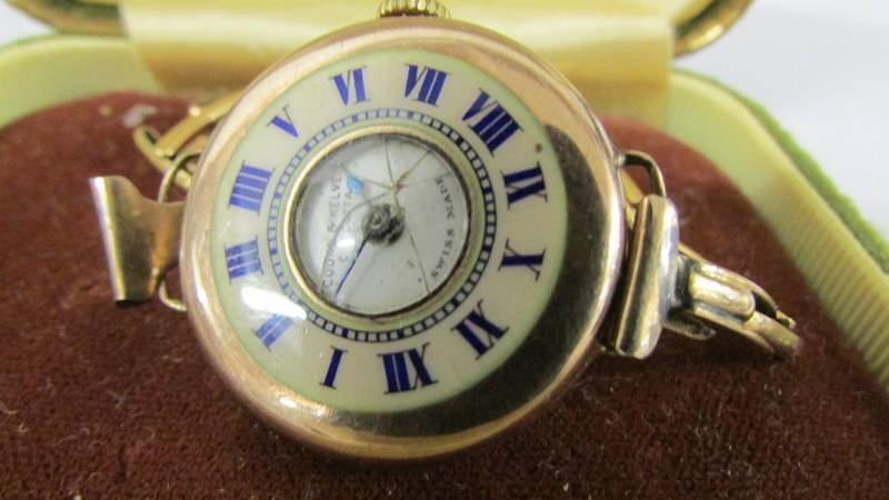 A gold watch made by Cooke and Kelvey of Calcutta witha CYMA Swiss movement. Inscribed "to May - Image 2 of 2