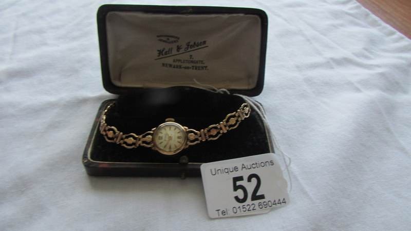 An Accurist gold ladies wrist watch. Bracelet hallmarked, case hallmarked, watch is wound to it's