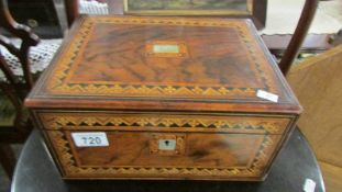 A mahogany inlaid sewing box and contents.