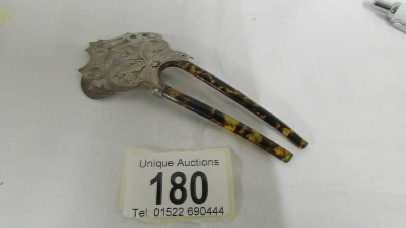 An Edwardian hall marked silver and horn hair pin.