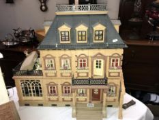A Georgian style dolls house and contents. 64cm x 36cm x 65cm