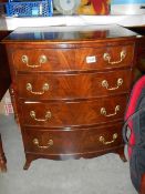 A good mahogany bow front chest of drawers on bracket feet.