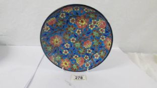A small Longwy floral decorated dish.
