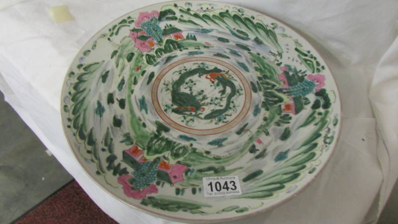 A 19C Chinese hand painted charger with impressed makers mark, 33.5 cm diameter. Collect only.