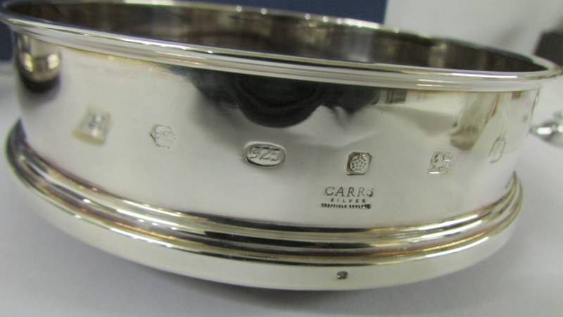 A boxed pair of Carr's hall marked silver wine coasters. Both in as new condition - Image 3 of 3