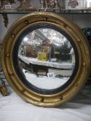 A circular framed convex mirror. Collect only. Diameter 50.5cm. Depth 6.5cm.