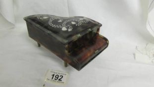 A Victorian faux tortoiseshell and mother of pearl musical jewellery box in the form of a grand