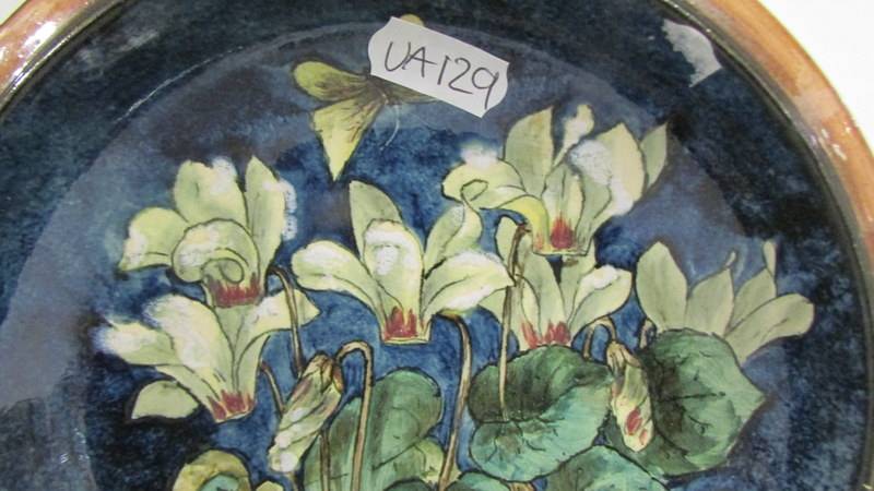 A Doulton Lambeth Faience pretty shallow dish painted with cyclamen and butterfly, also painted - Image 2 of 3