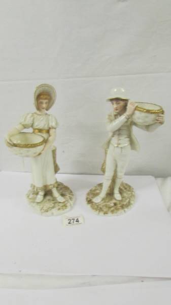 A pair of 19th century Royal Worcester figurines.