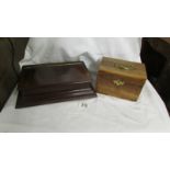 A mahogany tea caddy with brass fittings and another mahogany box.