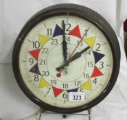 An R.A.F Sector style electric wall clock. Case is Bakelite with a Genalex electric movement. Unable