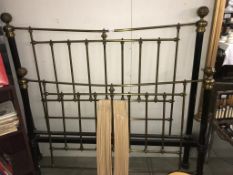A cast iron and brass double bed frame with slats (bed head 153cm wide) (COLLECT ONLY)