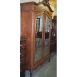 A good French two door armoire with mirrored doors.