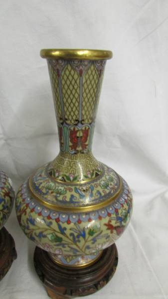 A pair of decorative Cloissonne vases on bases, vases 18cm tall, with bases 21.5cm tall. - Image 2 of 4